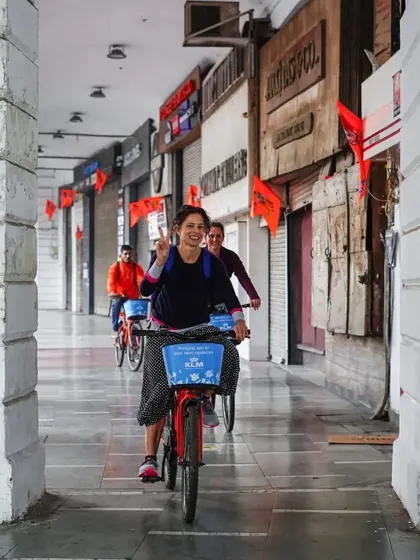 The joy of cycling through the corridors of Connaught Place. This rider's smile says it all.