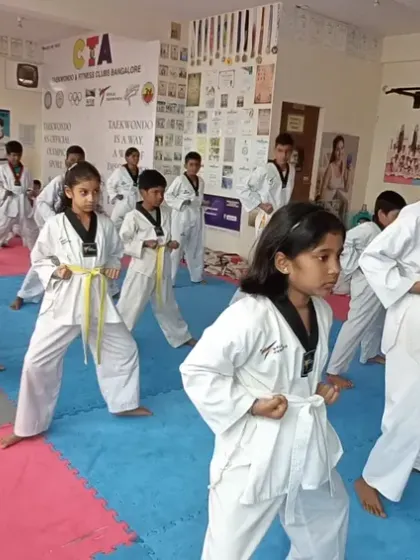 Our youngest students, the yellow belts, learning the basic fighting stance with enthusiasm.