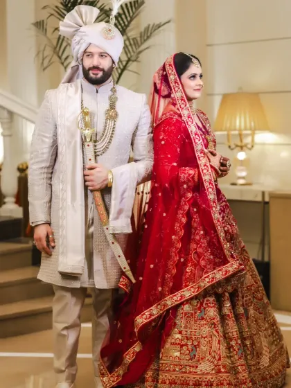 A classic back-to-back pose, showcasing the couple's style and confidence.