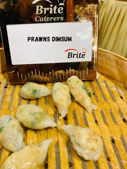 Freshly steamed Prawns Dim Sum, showcasing the translucent wrappers and fresh filling.