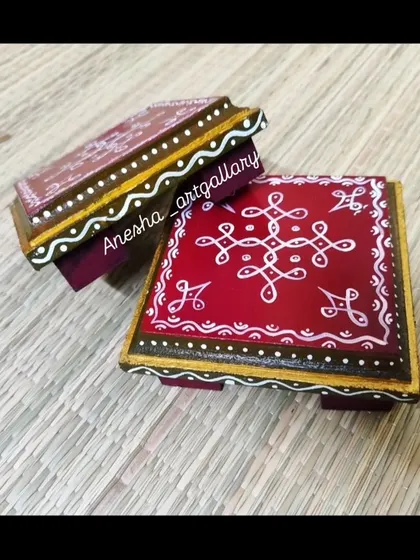 These are my hand-painted Pooja Chowkis, or small pedestals for placing deities or diyas. They are made from MDF wood and feature traditional South Indian kolam designs on a rich red background.