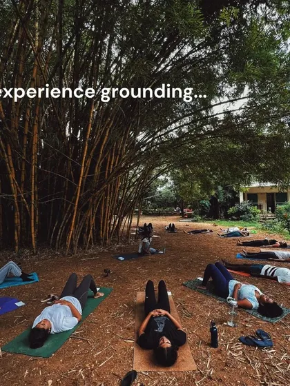 Finding deep rest and grounding during a guided Savasana session outdoors. There's nothing like feeling the earth beneath you as you let go of tension and stress.