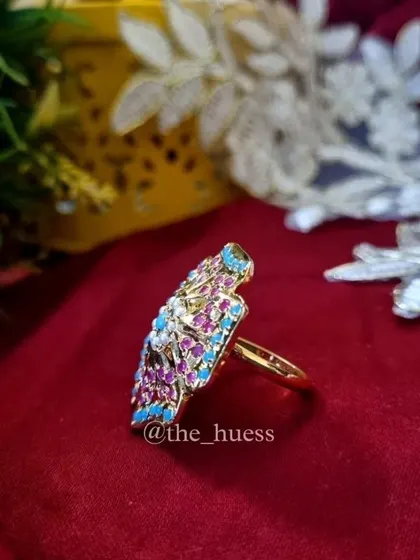 A side view of the "Anokhi" ring, showing its profile and the adjustable band. This demonstrates how the ring sits on the finger while ensuring a comfortable fit.