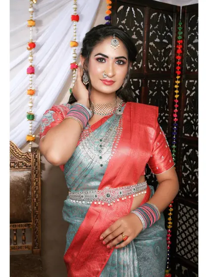 A beautiful model showcasing a CZ and pearl set. The combination of the choker, waist belt, and maang tikka creates a complete and polished look.
