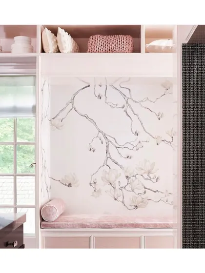 This delicate and subtle wallpaper from the Blossom collection by Phillip Jeffries is perfectly suited for a space with a neutral palette. Here it creates a serene and beautiful backdrop for a cozy reading nook.