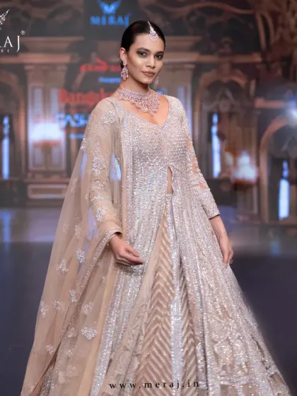 A closer view of the peach bridal Indo-Western, where elegance meets couture magic.
