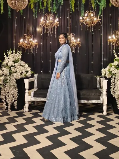 A stunning sangeet night look. This powder blue lehenga is fully adorned with sequins, creating a dazzling effect under the lights. It's designed for the woman who loves to sparkle.