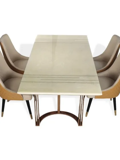 This elegant 4-seater dining set is perfect for a cozy yet luxurious dining nook. The table features a white marble top with delicate inlay details and a rose gold PVD base, matched with quilted leatherette chairs.