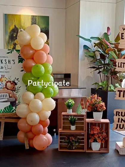 The entrance setup for Ekaksh's safari party. We used a welcome sign, a balloon pillar, and rustic wooden crates with jungle-themed signage to guide the guests.