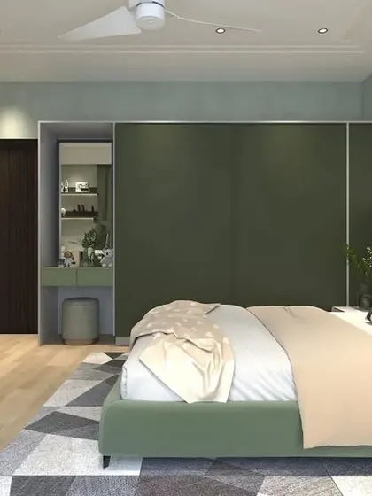 Another angle of the green bedroom, highlighting the sliding wardrobe with an integrated vanity nook.