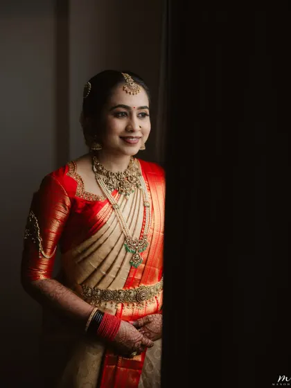 This dramatic, side-lit portrait highlights the bride's flawless makeup. The contouring and highlighting are visible, showing the dimension I create.