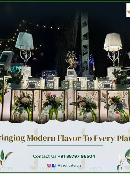 A modern and elegant buffet line with illuminated floral displays inside the counter bases, topped with stylish lamps for a warm glow.