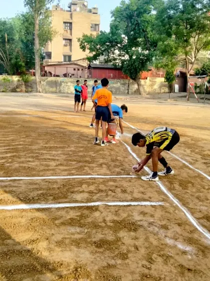 Players preparing the lines on our kabaddi ground. Attention to detail is important in every aspect of the sport.