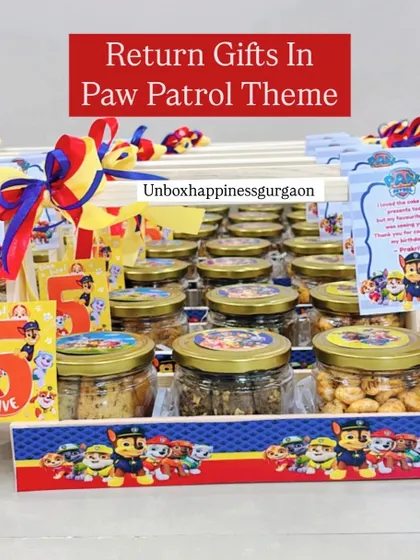 No theme is too big or small. Here's a look at a fun 'Paw Patrol' themed return gift basket, filled with jars of delicious snacks and customized with characters from the show, perfect for a 5th birthday party.