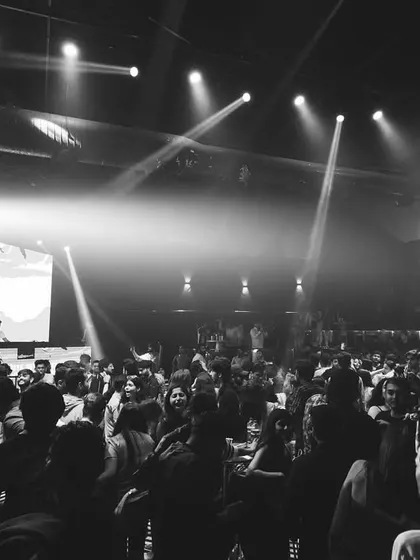 A black and white photo of the packed floor at Elrow. Even without color, you can feel the energy and movement of the crowd.