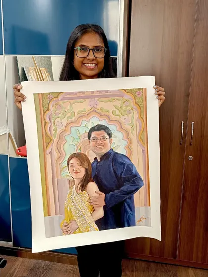 A happy moment with a finished couple's portrait, featuring a beautiful custom background.