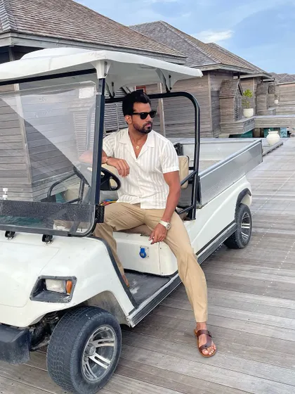 The resort wear ensemble is stylish enough for a ride around the resort, blending comfort with a polished look.