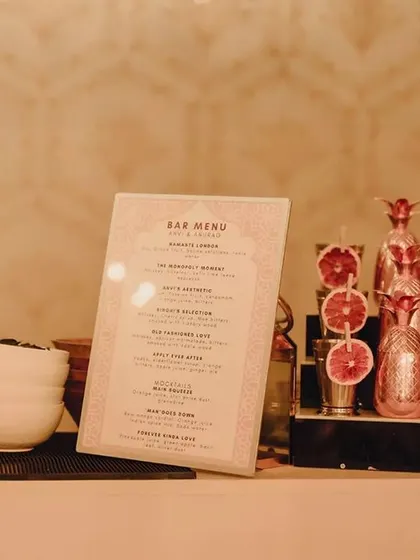 The bar details were meticulously planned, from the custom menu to the themed barware with dried citrus garnishes, making every drink an experience.