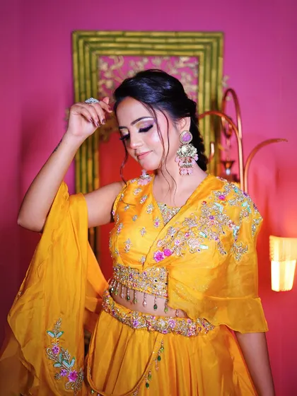 A final close-up of the yellow Haldi lehenga, highlighting the beautiful details.