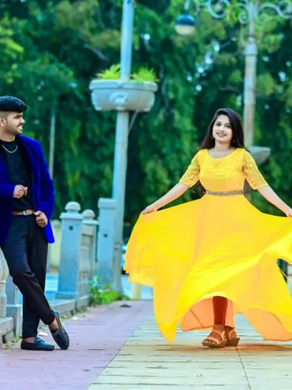 A pop of sunshine. This couple looks so happy and vibrant in our yellow flared gown and a bold blue velvet blazer.
