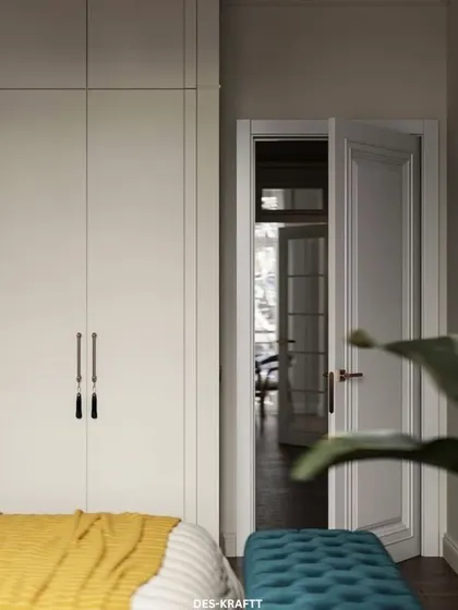 A glimpse from the bed towards the doorway, showing the seamless integration of the wardrobe and the continuation of the room's bright, welcoming feel.