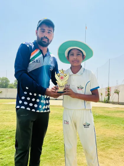 Dhruv Jangra receiving his Man of the Match award after taking a hat-trick.