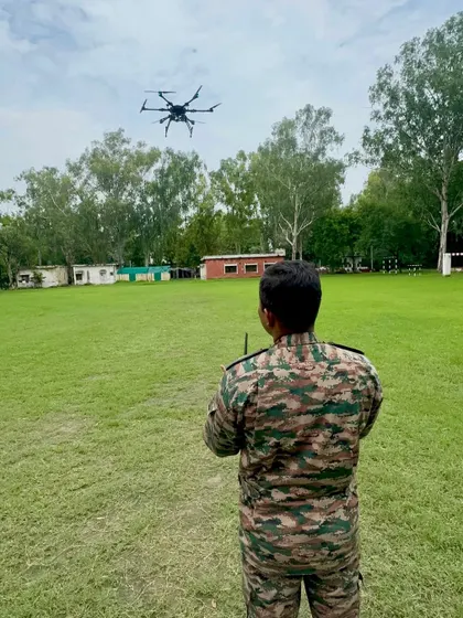 A soldier executes a training flight with a hexacopter in an open field. My program emphasizes flying in real-world conditions to prepare them for any operational environment.