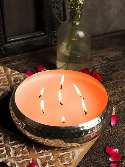 A large, multi-wick Urli candle in a hammered silver bowl. This makes a stunning centerpiece for any large table or entryway.