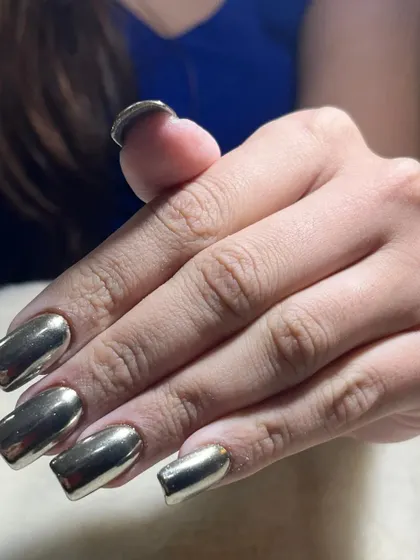 A side view of the silver chrome nails, showing the perfectly smooth and reflective surface that I achieve with this technique.