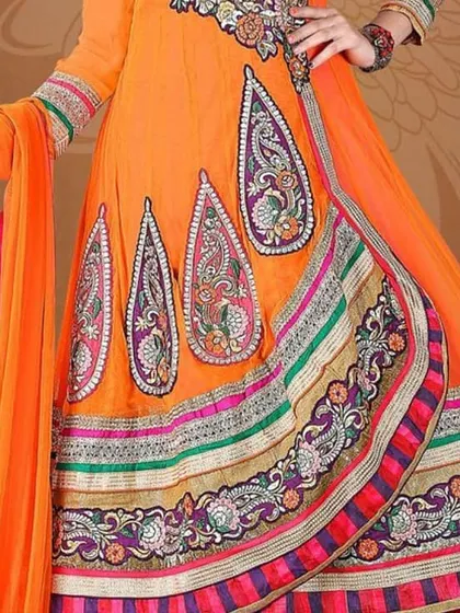 An Anarkali suit with intricate paisley embroidery. I tailor the length and flare of the Anarkali to your preference, ensuring a graceful and flattering silhouette.