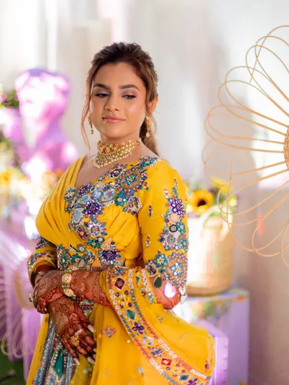 A poised shot of the bride at her Haldi ceremony. The entire look is vibrant and full of life.