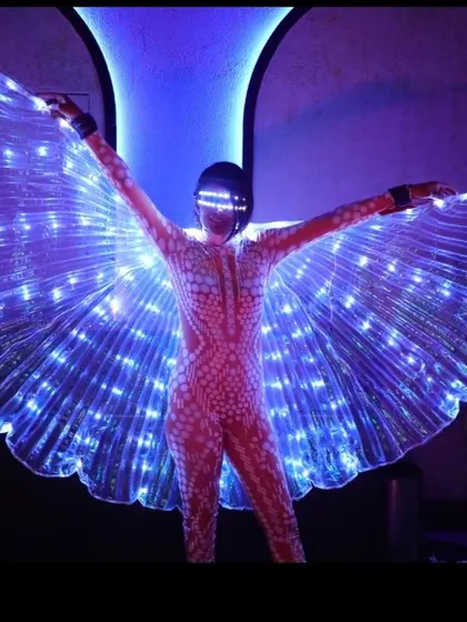 A full-body shot with the LED wings spread wide. This pose showcases the full scale and beauty of the prop, perfect for making a grand entrance.