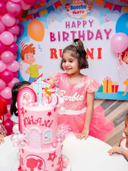 The birthday girl with her Barbie dreamhouse cake! Seeing smiles like this is the best part of my job.
