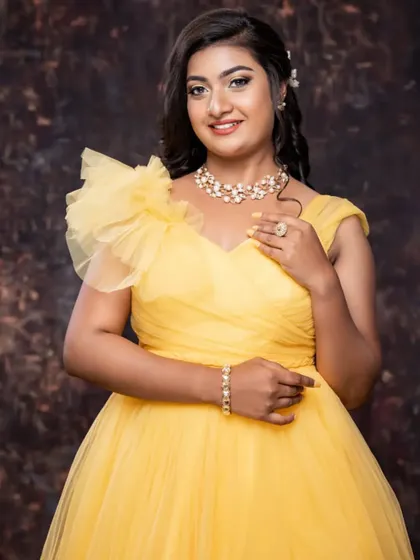 A beautiful portrait of the client in the yellow gown, looking radiant.
