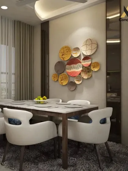An elegant dining room setup. The space is centered around a contemporary dining table and chairs, with a unique wall art installation that serves as a colorful focal point.