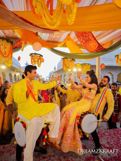 A moment of pure joy and energy as the couple joins in on the dhol drumming at their Haldi ceremony. We love creating interactive and fun-filled moments that get everyone involved.