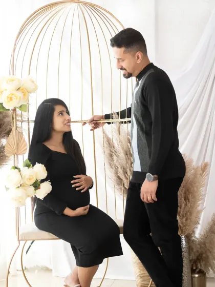 A beautiful couple's portrait in our boho-themed setup with the golden birdcage chair. The shared look between them is full of love and anticipation.