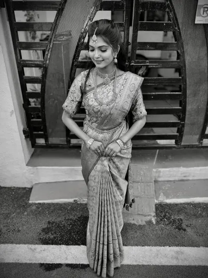 A black and white shot that highlights the texture and form of the fluffy pleats, turning the drape into a work of art.