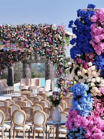 A closer look at the vibrant, multi-colored floral arrangements that adorned the wedding mandap. I use a mix of hydrangeas, roses, and other seasonal blooms to create rich textures and a stunning visual impact.