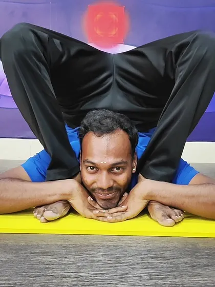 A close-up of the intense Yoganidrasana pose, highlighting the practitioner's dedication and advanced level of practice.