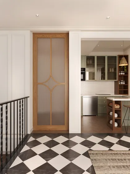 This view shows the lounge's proximity to a compact kitchenette, separated by a custom wooden door with a frosted glass panel. This design creates a functional and convenient multi-use space for the family on the upper level.