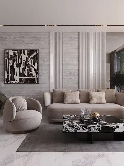 This living area combines geometric forms with soft textures. A faceted console and a striking black-and-white coffee table are balanced by plush, curved seating, creating a space that is both modern and comfortable.