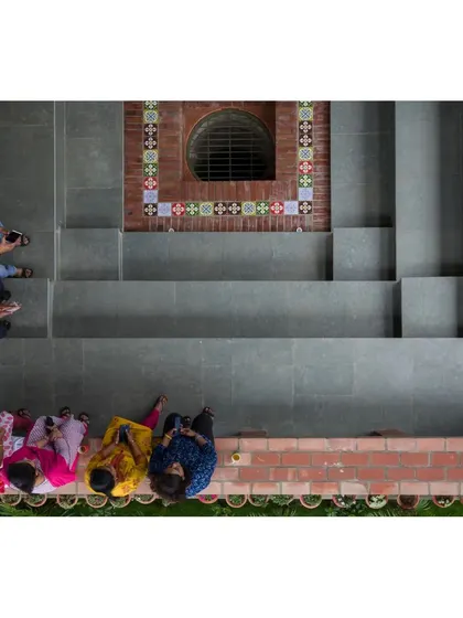 An overhead view of the stepped well at the ASA Office, designed as a community gathering space. This feature is a modern interpretation of a traditional Indian 'baori' and serves as a social heart for the building.