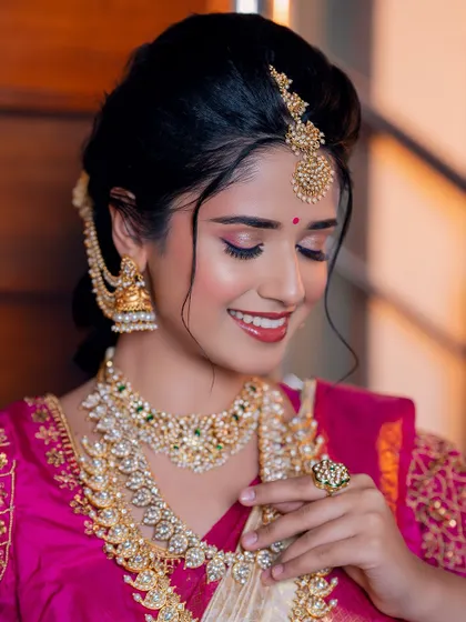 A happy bride is the most beautiful bride. Her smile truly completes this enchanting look, highlighting the radiant skin and sparkling eyes I crafted for her.