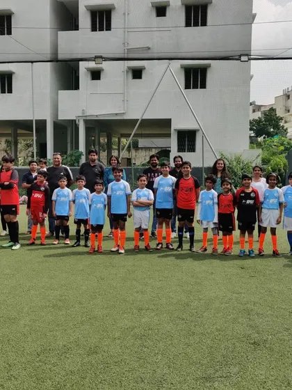 Two teams of our younger players line up with their parents watching. I encourage family involvement in our events.