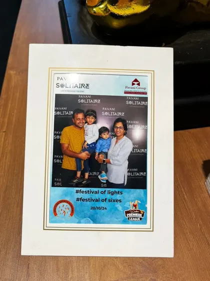 A framed photo from a Diwali 'Festival of Lights' corporate event. Our classic selfie booth provides high-quality prints that can be instantly framed, offering a premium and lasting souvenir for family day celebrations.