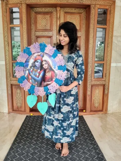 A happy client with her custom Radha Krishna macrame frame. We love seeing our creations bring joy and devotion into our clients' homes.