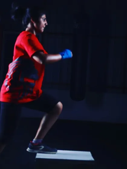The initial phase of a box jump, demonstrating proper form and preparation for an explosive movement. Every drill begins with a solid foundation to ensure safety and maximize effectiveness.