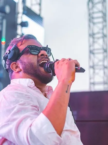 On the mic, singing along with the crowd. The connection during these sets is magical.