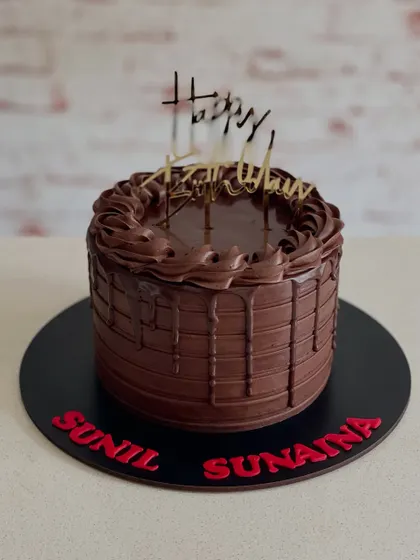 A rich chocolate drip cake for a joint birthday celebration. Sometimes, all you need is pure, decadent chocolate.
